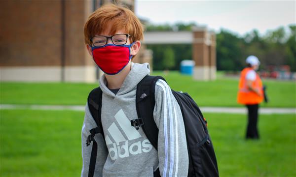 student smiles on first day of school